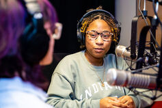 Two students recording an audio program.
